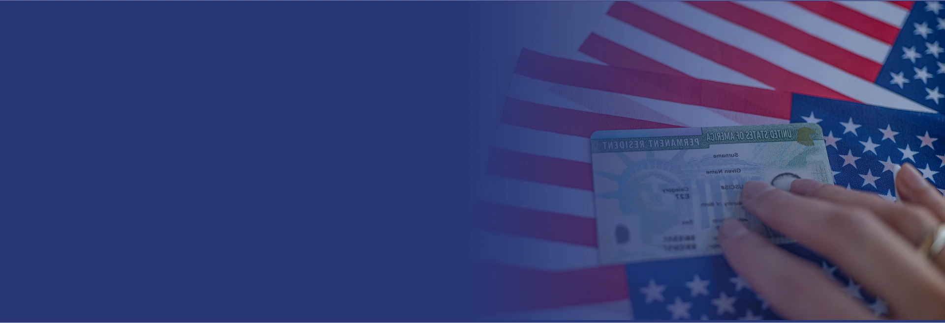 A permanent resident card held against the Stars and Stripes