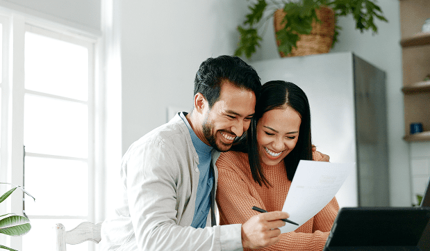 Couple reviewing their green card options at home