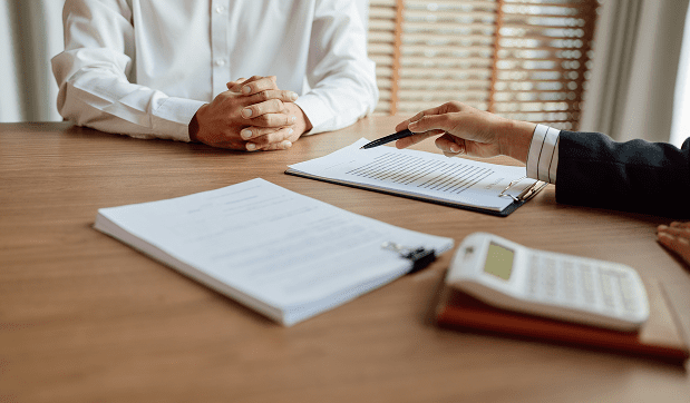 Immigration consultant walking a client through the paperwork