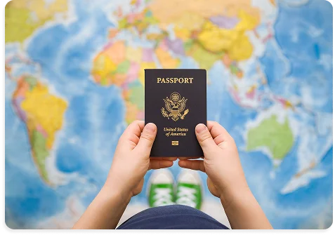 Passport held over a world map, ready for notarization