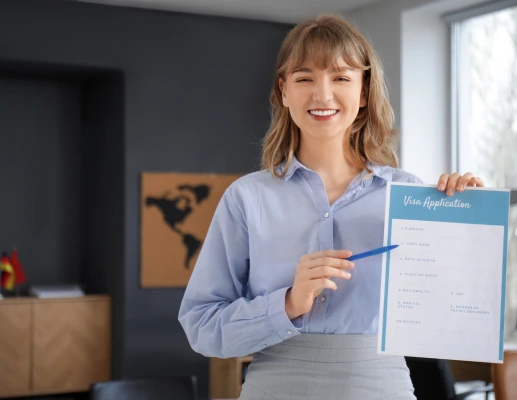 Rush In Documentation Center specialist holding a Russian visa application form
