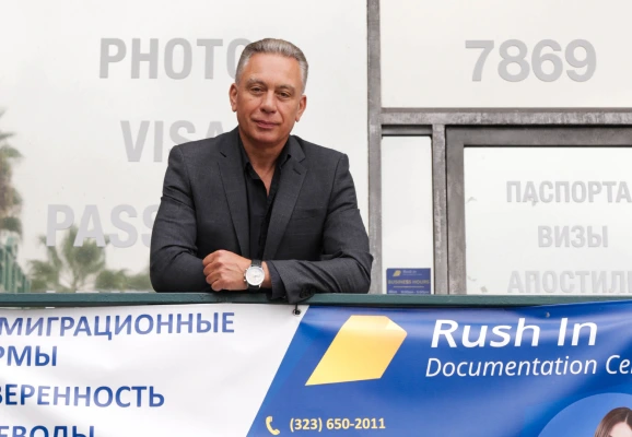 Russian visa specialist reviewing an application at the Rush In office